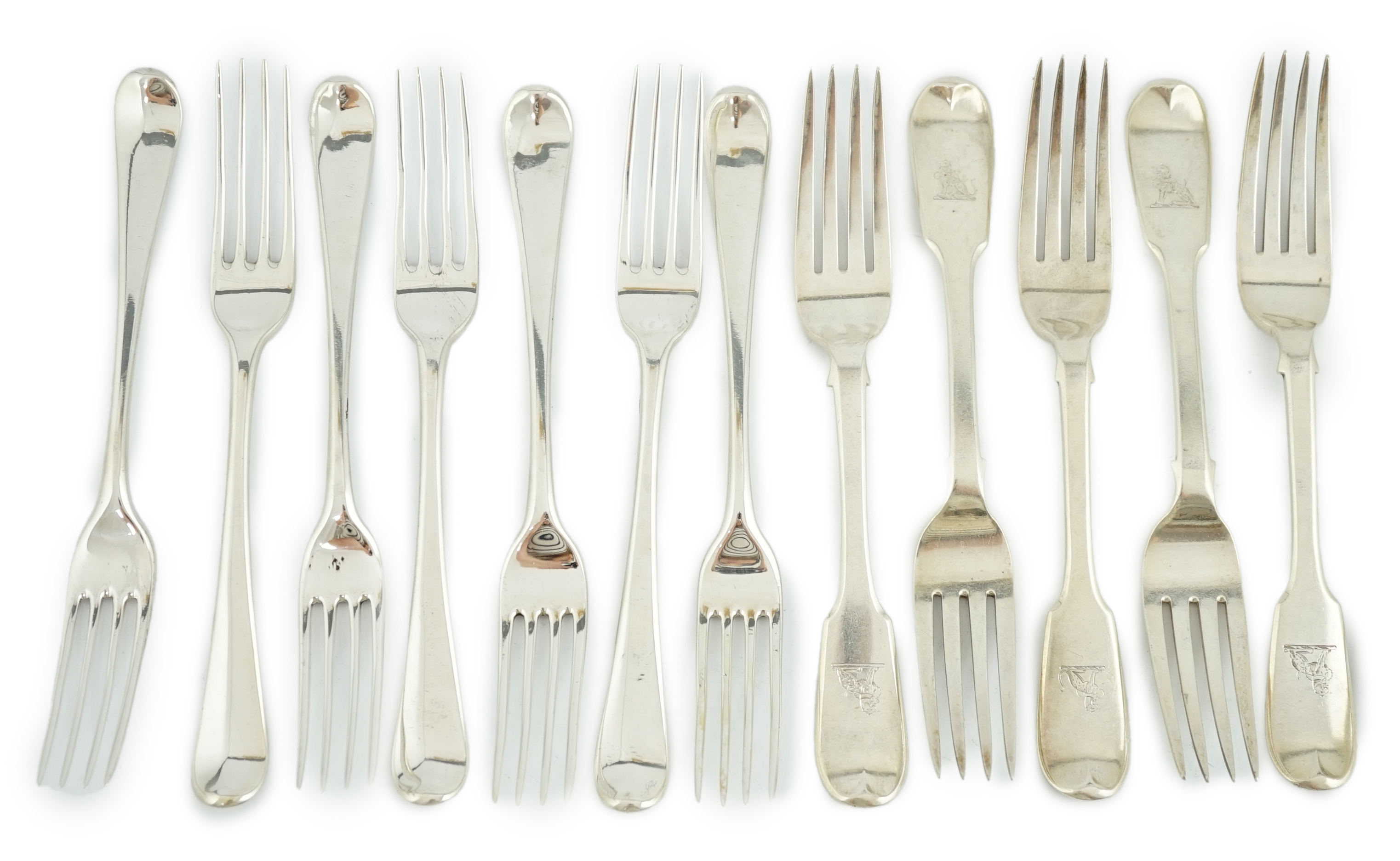 A set of seven George III silver Hanovarian pattern table forks, George Smith, London, 1776, 20.2cm, together with a set of six William IV Irish silver fiddle pattern table forks, Thomas Farnett, Dublin, 1831